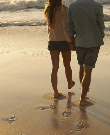 Couple walking on the beach