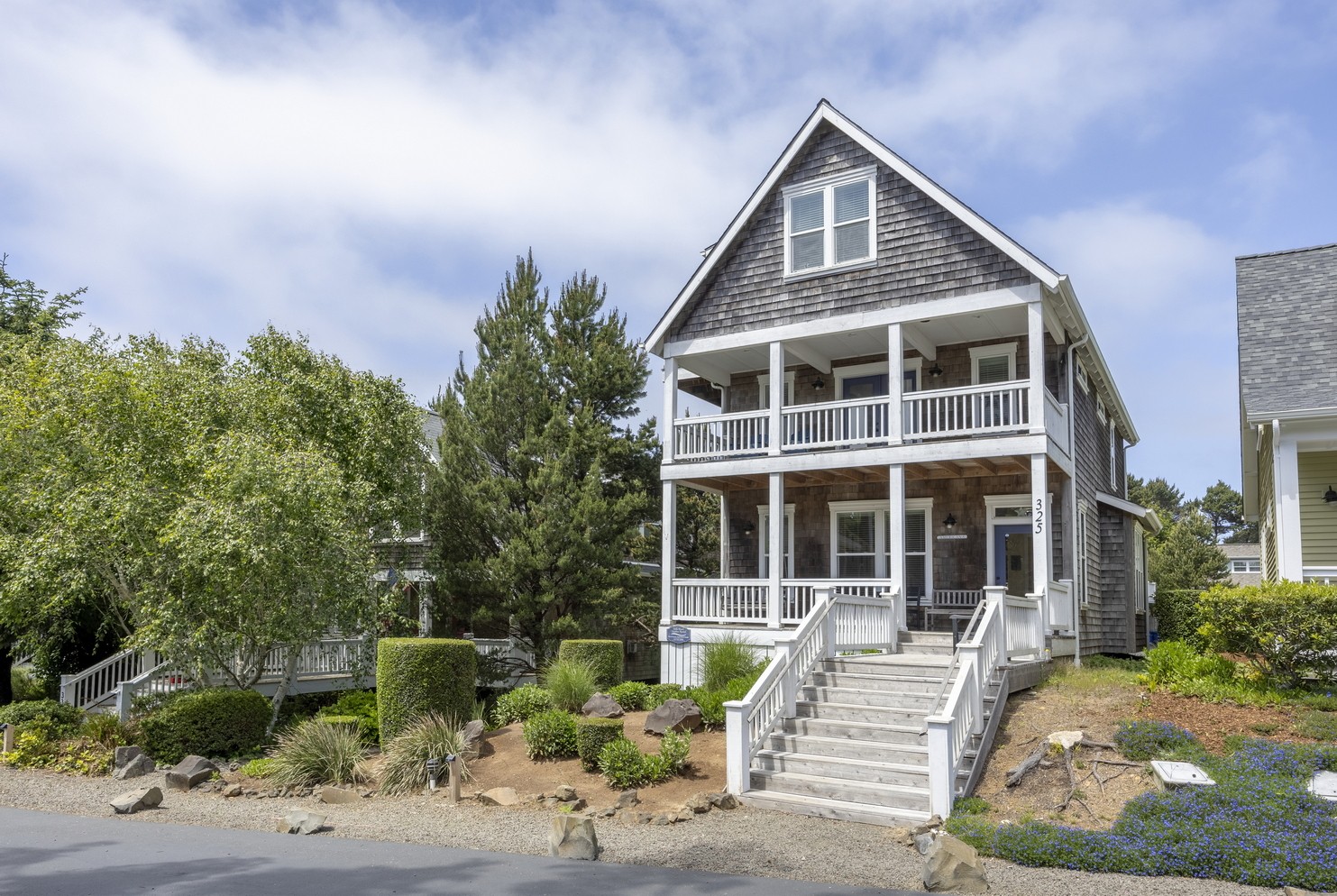 Americana beach home in Bella Beach Oregon with multiple decks and coastal architecture steps to ocean