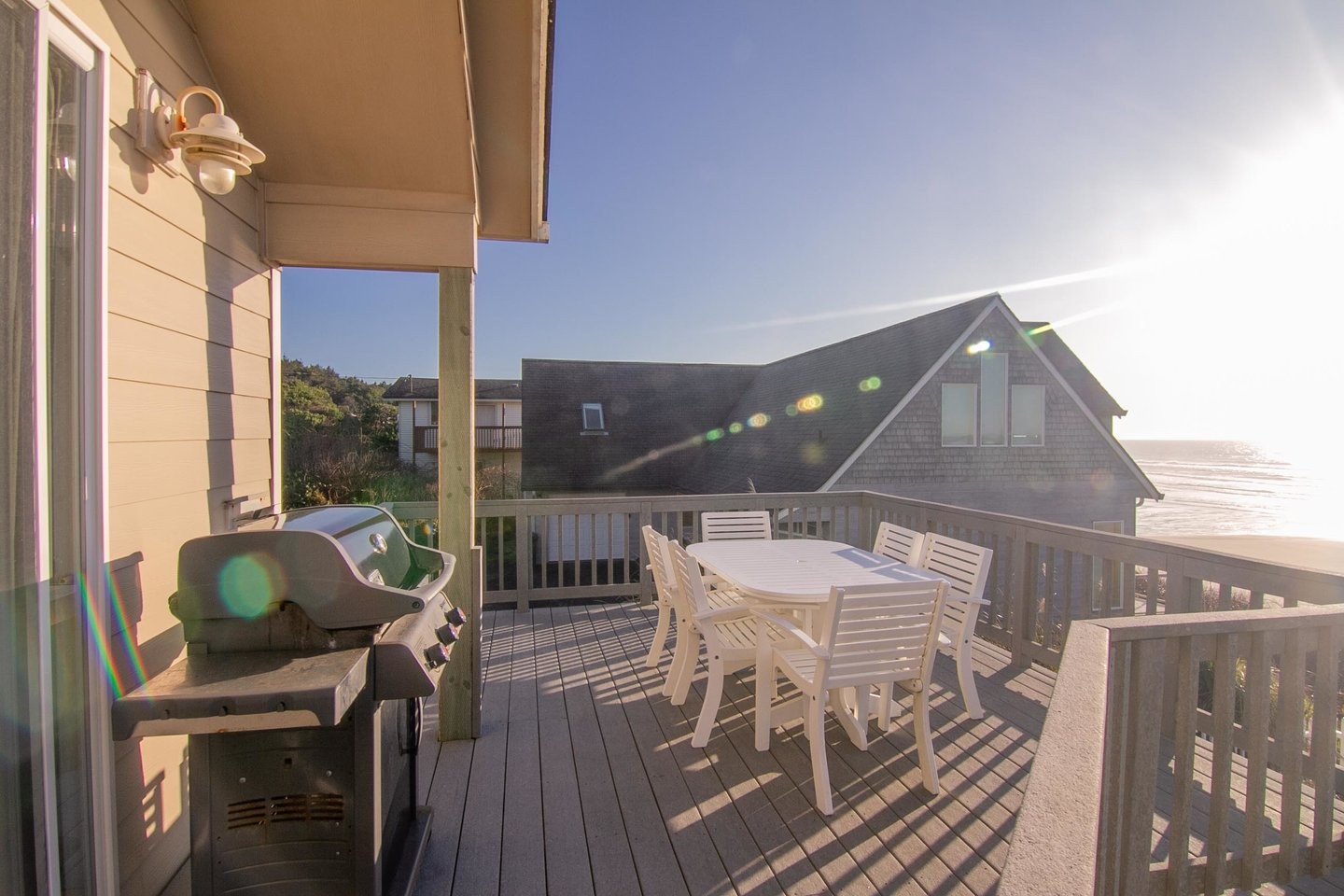 Ocean front view of vacation home in South Beach Oregon with BBQ and Outdoor Dining Table
