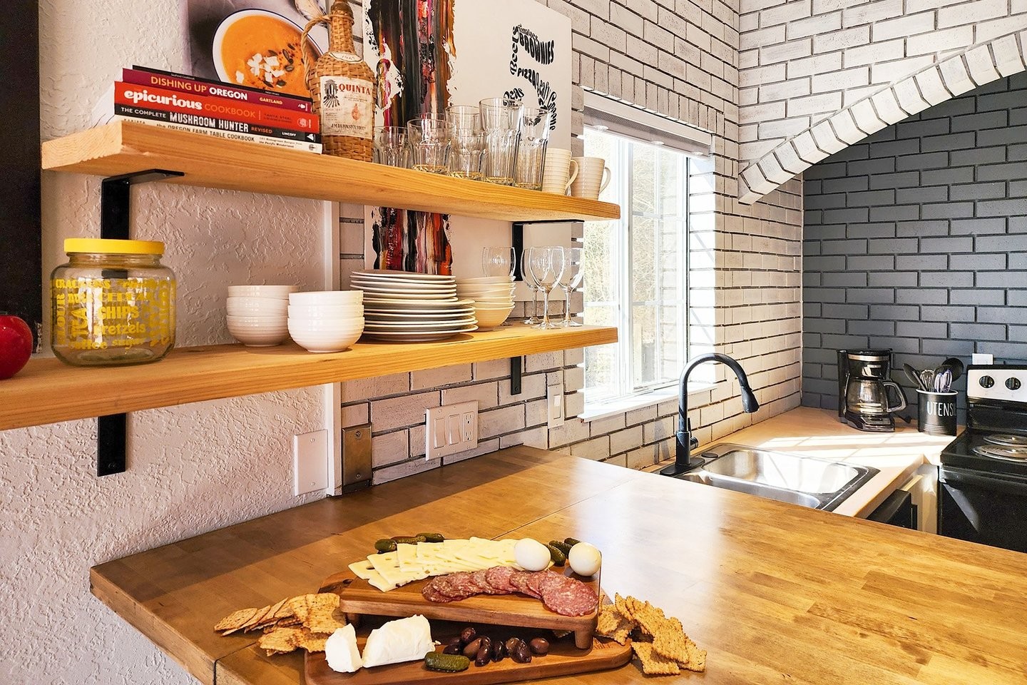 Kitchen sink, open shelving white and grey tile, coffee maker